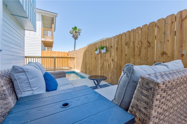 wooden terrace featuring a fenced in pool