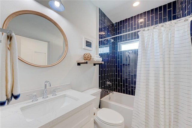 full bathroom featuring shower / bath combo, vanity, and toilet