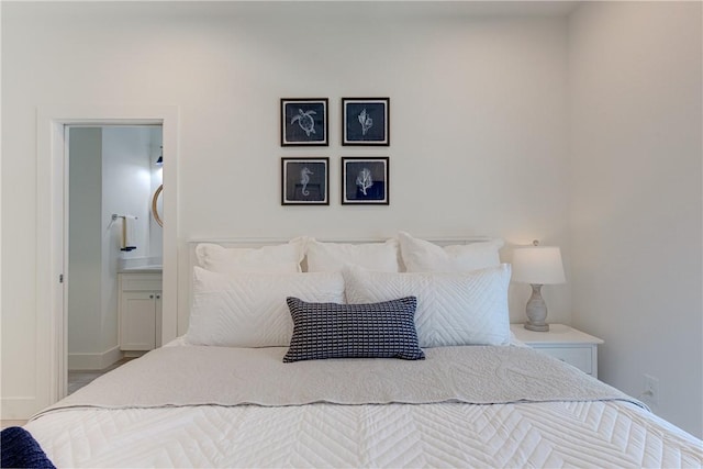 bedroom featuring ensuite bath