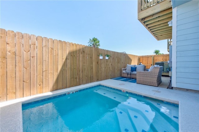 view of pool featuring outdoor lounge area and a patio