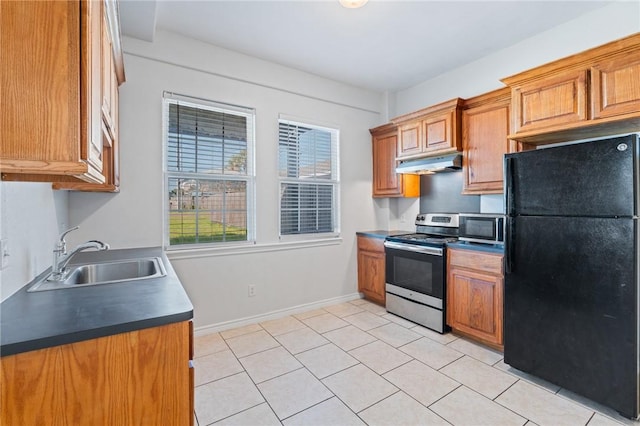 410 Knickerbocker St, Corpus Christi, TX 78418 - kitchen with stainless steel appliances, under cabinet range hood, a sink, baseboards, and brown cabinets
