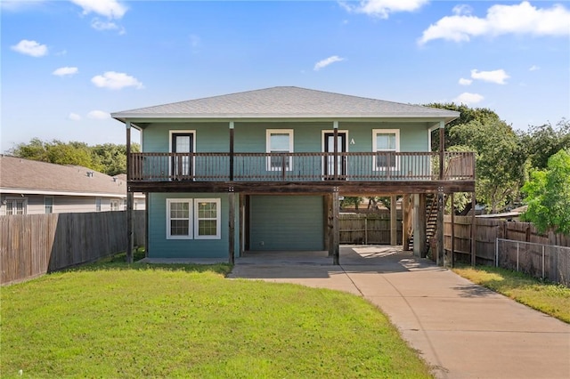 410 Knickerbocker St, Corpus Christi, TX 78418 - view of front facade with driveway, a garage, covered porch, and stairs
