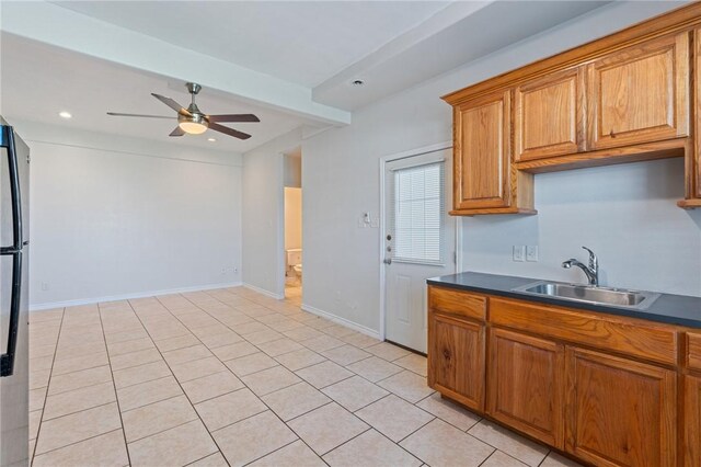 410 Knickerbocker St, Corpus Christi, TX 78418 - kitchen featuring a sink, ceiling fan, brown cabinetry, dark countertops, and recessed lighting