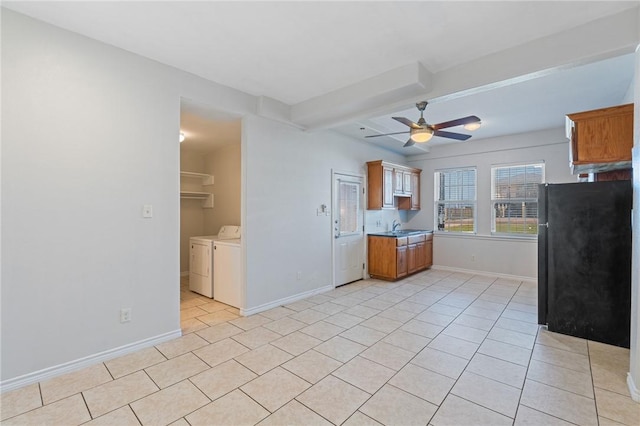 410 Knickerbocker St, Corpus Christi, TX 78418 - kitchen with washer and dryer, freestanding refrigerator, light tile patterned flooring, a ceiling fan, and baseboards