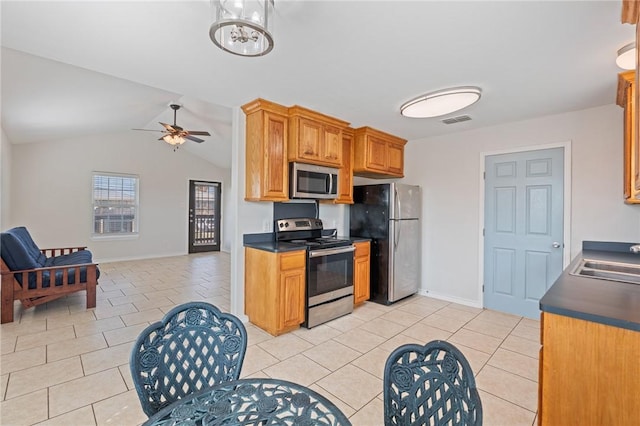 410 Knickerbocker St, Corpus Christi, TX 78418 - kitchen with stainless steel appliances, open floor plan, dark countertops, light tile patterned flooring, and a sink