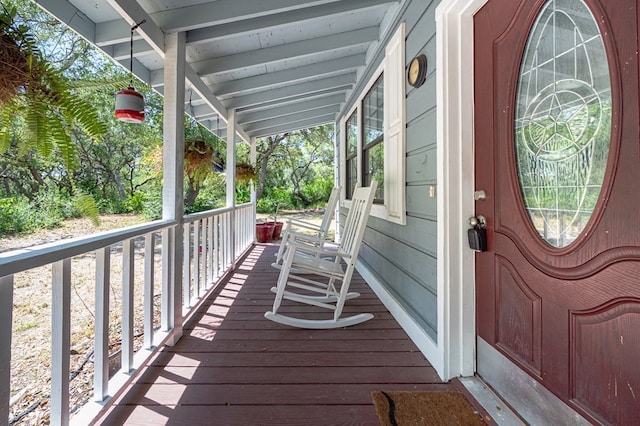 property entrance with covered porch