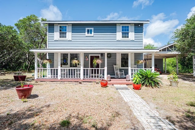 farmhouse-style home featuring covered porch