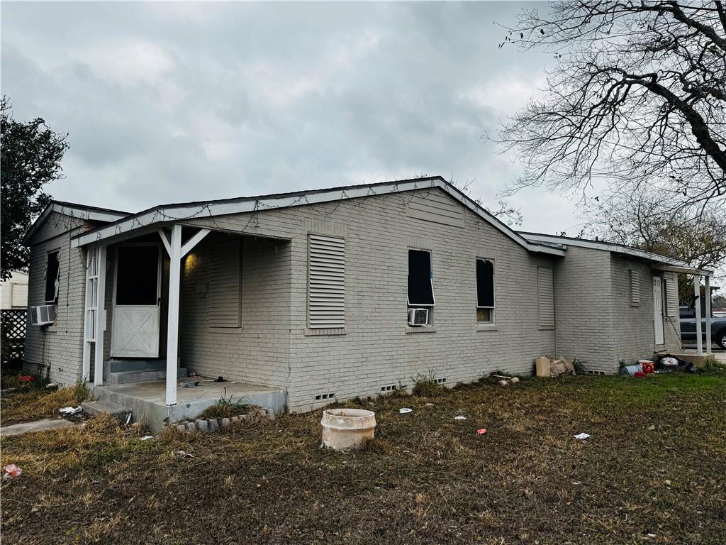 back of property featuring cooling unit