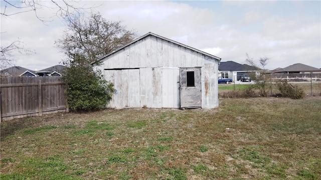 view of outdoor structure with fence and an outdoor structure