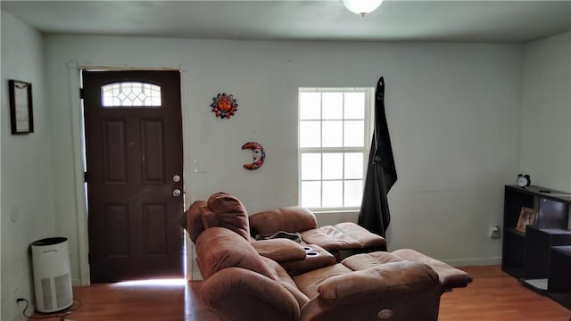 living area with light wood finished floors and baseboards