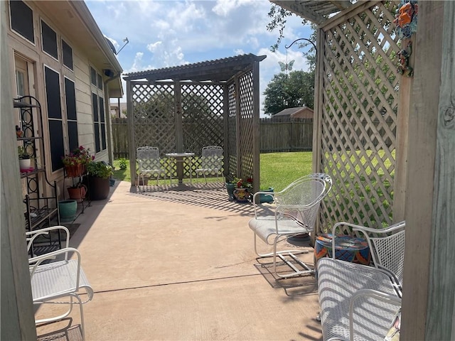5413 Fisher Cir, Corpus Christi, TX 78413 - fenced backyard with a pergola and a patio area