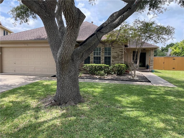 5413 Fisher Cir, Corpus Christi, TX 78413 - view of front of property with roof with shingles, brick siding, a garage, and concrete driveway