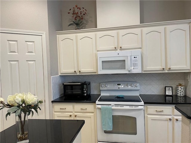 5413 Fisher Cir, Corpus Christi, TX 78413 - kitchen featuring white appliances, dark countertops, and backsplash