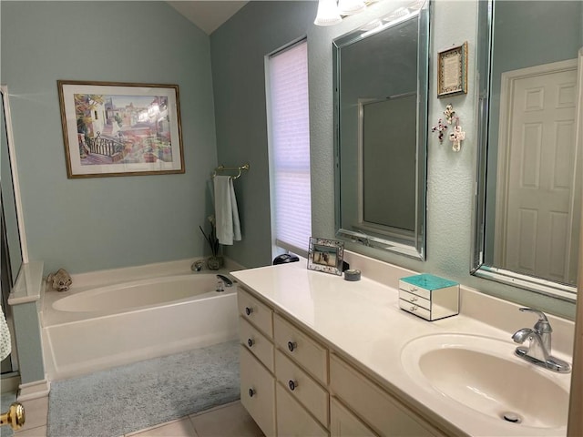 5413 Fisher Cir, Corpus Christi, TX 78413 - full bathroom featuring tile patterned flooring, a garden tub, vanity, and vaulted ceiling