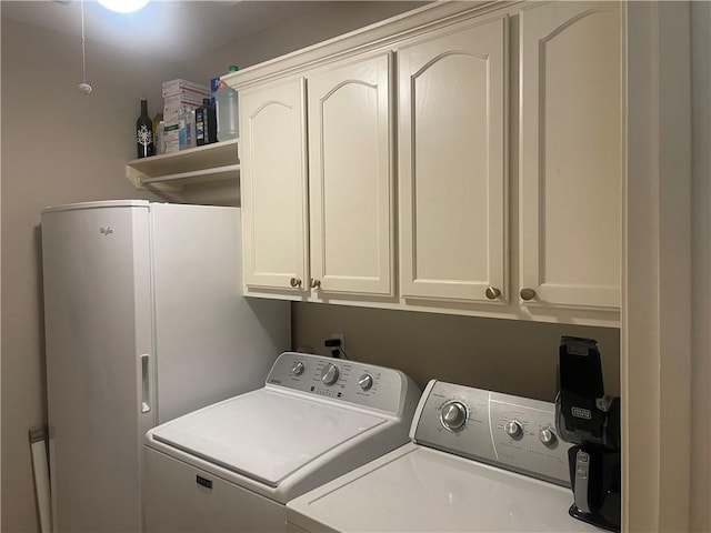 5413 Fisher Cir, Corpus Christi, TX 78413 - laundry area featuring washing machine and dryer and cabinet space