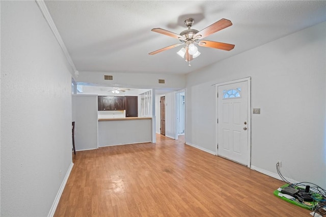 3730 Lincoln St, Corpus Christi, TX 78415 - unfurnished living room featuring light wood-style floors and a ceiling fan