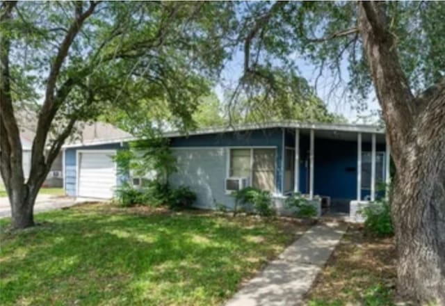 3730 Lincoln St, Corpus Christi, TX 78415 - view of front of home featuring a garage and a front yard