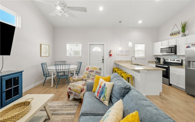 15101 Boca Grandi Dr, Corpus Christi, TX 78418 - living area featuring baseboards, light wood-style flooring, recessed lighting, and a ceiling fan