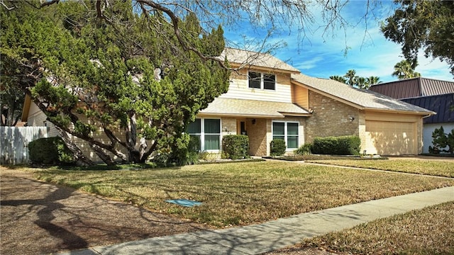 view of front of property featuring a garage, driveway, a shingled roof, brick siding, and a front yard