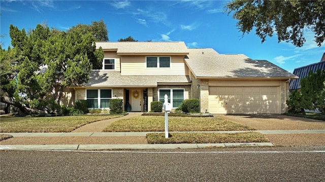 view of front of house with a garage, a front yard, driveway, and a shingled roof