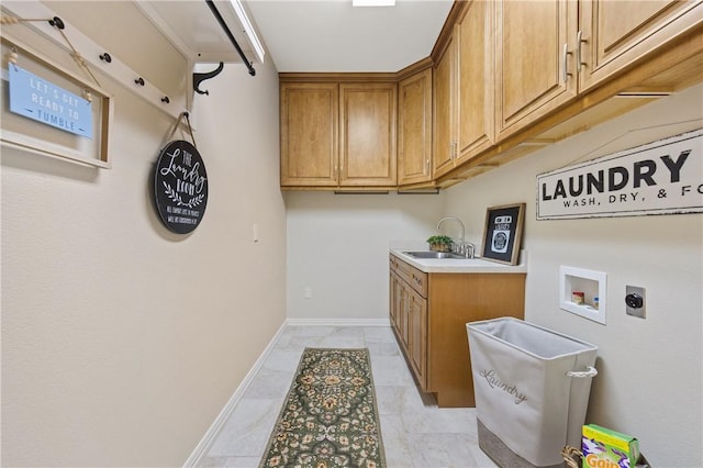 6031 Lost Creek Dr, Corpus Christi, TX 78413 - laundry room with a sink, hookup for an electric dryer, hookup for a washing machine, baseboards, and cabinet space