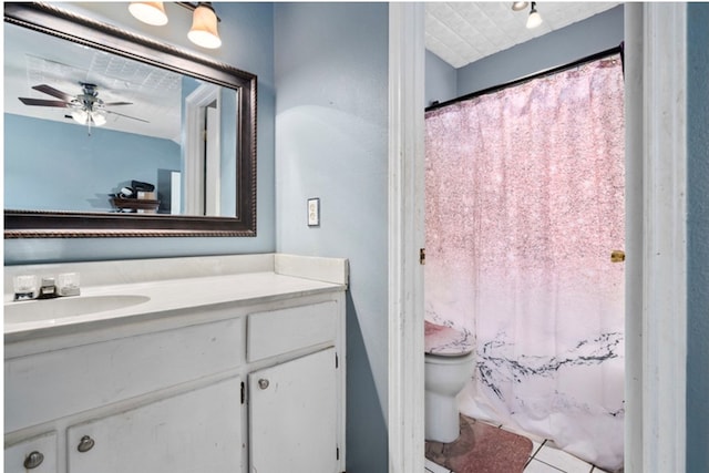 bathroom featuring vanity, tile patterned flooring, ceiling fan, toilet, and curtained shower