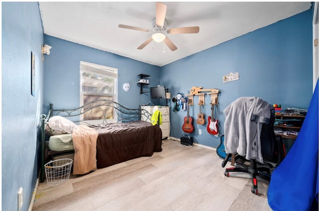 bedroom featuring ceiling fan and light wood-type flooring