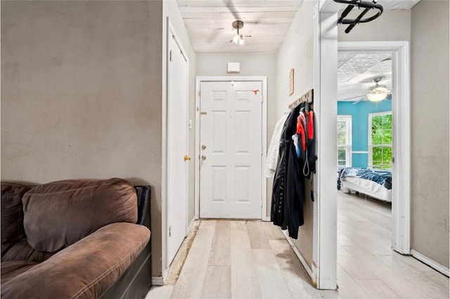 foyer featuring light hardwood / wood-style flooring and wood ceiling