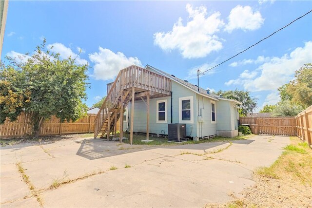 4338 Cottage St, Corpus Christi, TX 78415 - back of property with stairway, cooling unit, a wooden deck, and a patio area
