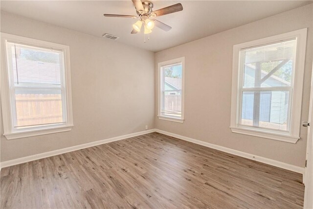 4338 Cottage St, Corpus Christi, TX 78415 - unfurnished room with wood finished floors, baseboards, and ceiling fan