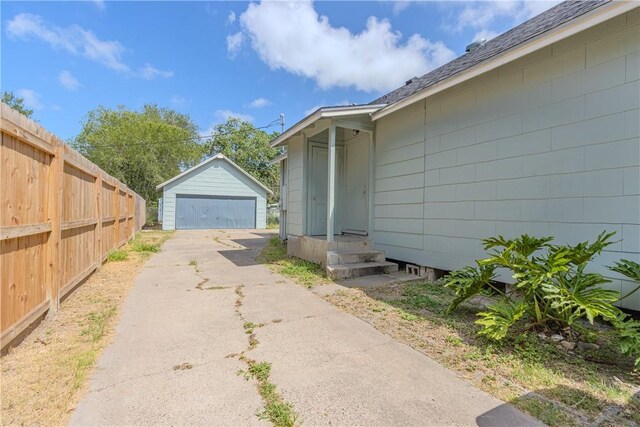 4338 Cottage St, Corpus Christi, TX 78415 - view of home's exterior with a garage and an outbuilding