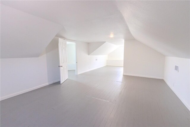 4338 Cottage St, Corpus Christi, TX 78415 - additional living space featuring wood finished floors, lofted ceiling, and baseboards