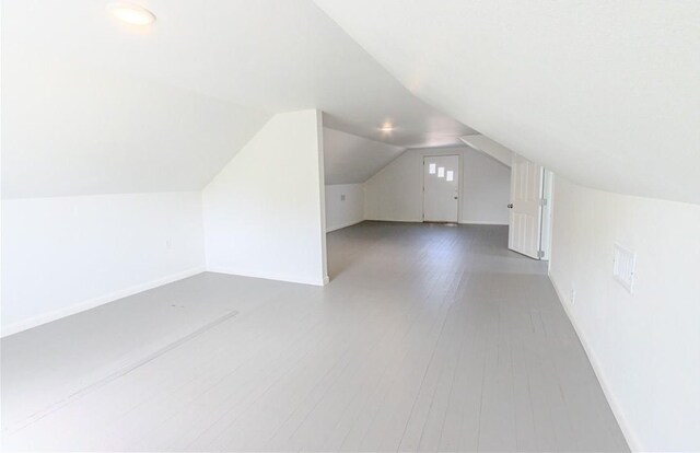 4338 Cottage St, Corpus Christi, TX 78415 - additional living space with vaulted ceiling, baseboards, wood finished floors, and recessed lighting