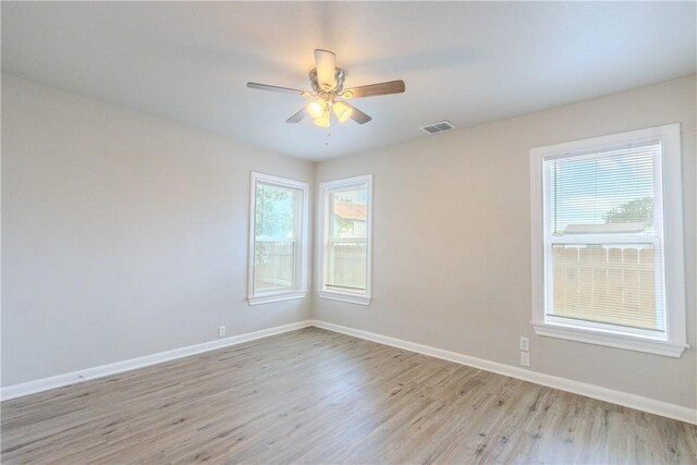 4338 Cottage St, Corpus Christi, TX 78415 - unfurnished room with light wood-style floors, baseboards, and ceiling fan