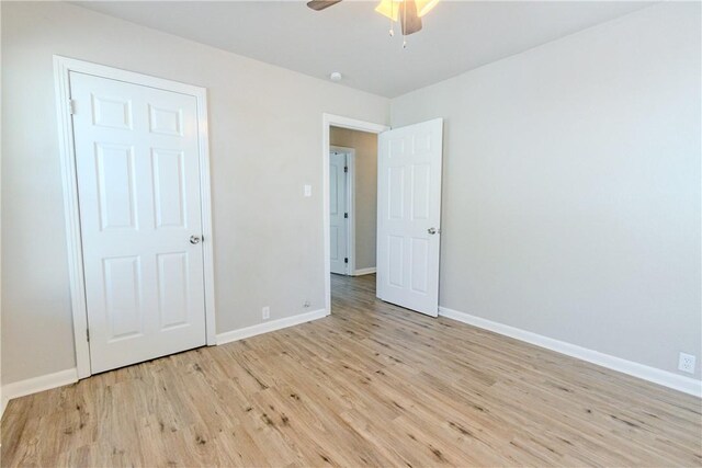4338 Cottage St, Corpus Christi, TX 78415 - unfurnished bedroom featuring light wood-style flooring, baseboards, and a ceiling fan