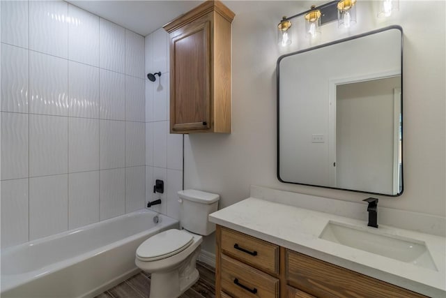 1055 N King St, Alice, TX 78332 - bathroom with vanity, toilet,  shower combination, and wood finished floors