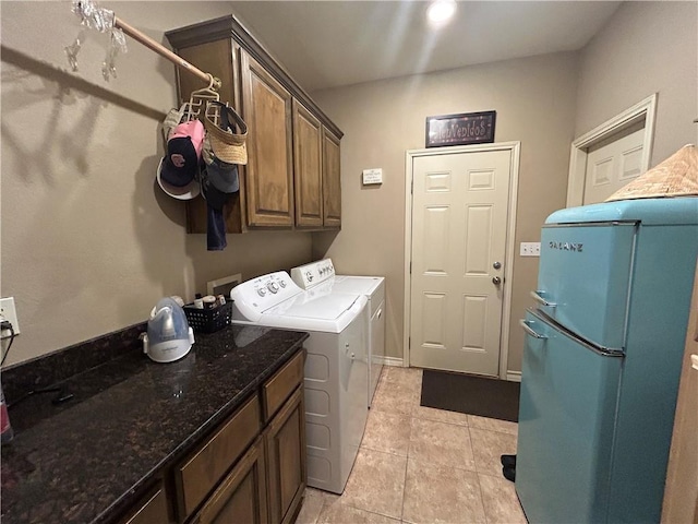 1645 W Manor Dr W, Corpus Christi, TX 78412 - laundry area with cabinet space, washing machine and dryer, and light tile patterned flooring