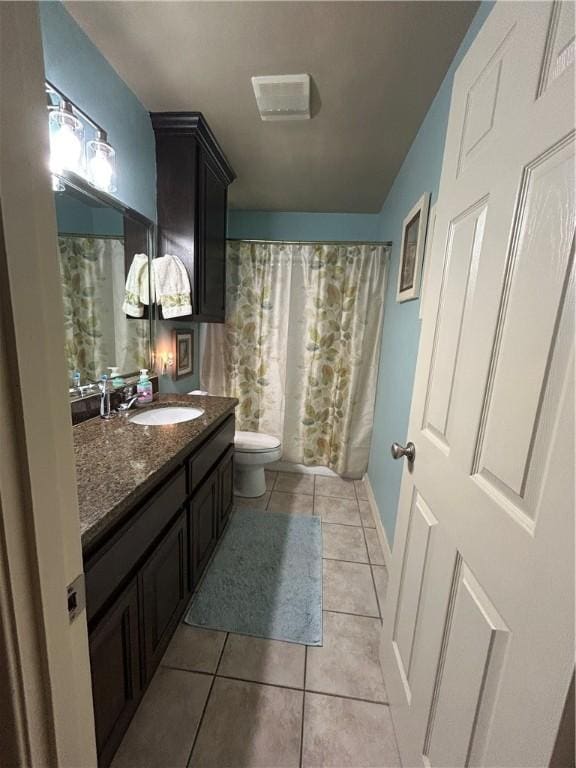 1645 W Manor Dr W, Corpus Christi, TX 78412 - full bathroom with vanity, tile patterned floors, and a shower with shower curtain