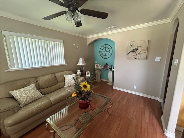 1645 W Manor Dr W, Corpus Christi, TX 78412 - living room with arched walkways, wood finished floors, a ceiling fan, and crown molding