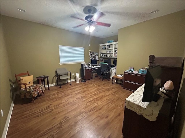 1645 W Manor Dr W, Corpus Christi, TX 78412 - office featuring wood finished floors, ceiling fan, and a textured ceiling