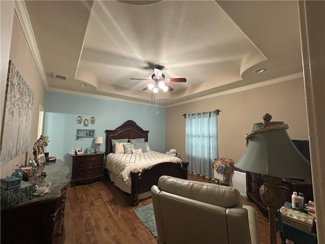 1645 W Manor Dr W, Corpus Christi, TX 78412 - bedroom with a raised ceiling, wood finished floors, crown molding, and ceiling fan