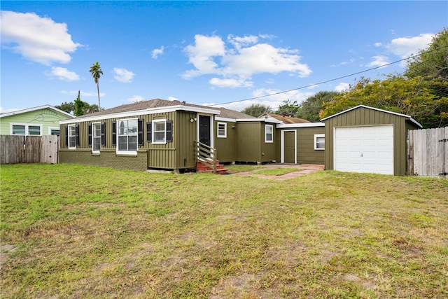 rear view of property featuring a yard