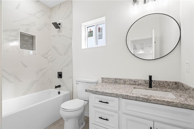 bathroom with vanity, toilet, and shower / bathtub combination