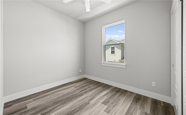 unfurnished room featuring hardwood / wood-style flooring and ceiling fan