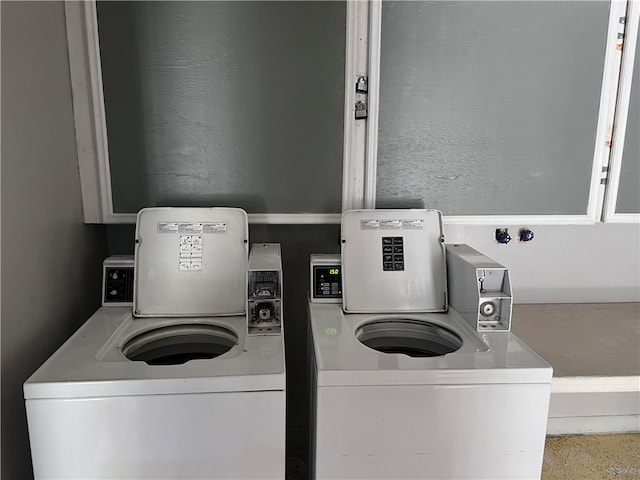 washroom with washing machine and dryer