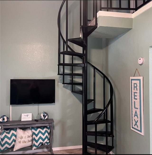 staircase with wood-type flooring