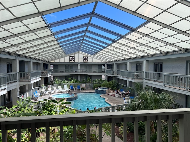 view of pool featuring a patio area and an in ground hot tub