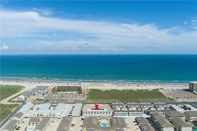 birds eye view of property featuring a water view and a beach view