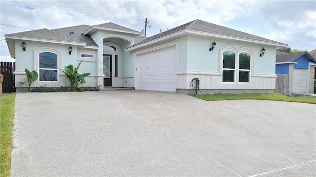 single story home featuring a garage