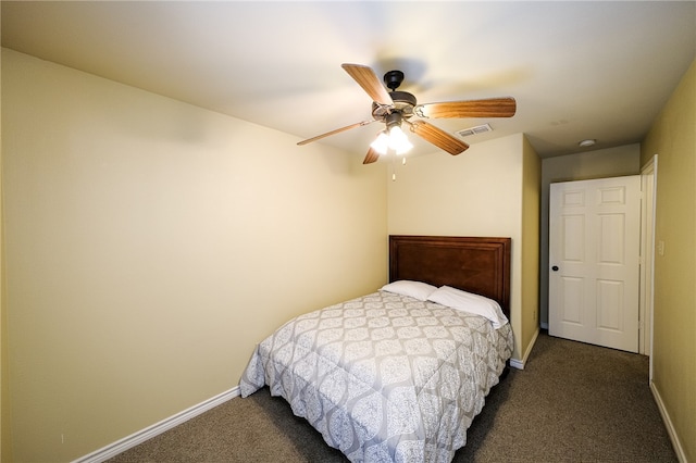 bedroom featuring ceiling fan and dark carpet